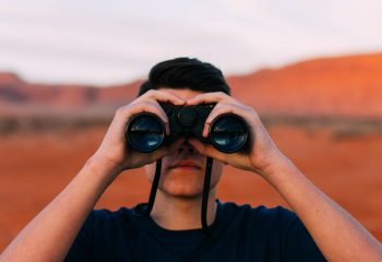 Canva - Man Looking Through Binoculars